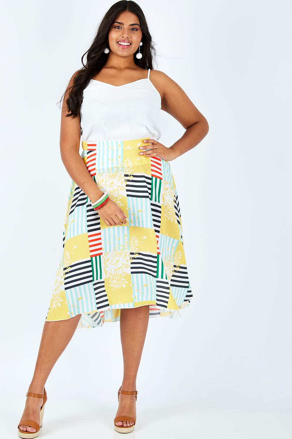 Model Shanaya wearing size 14 of the Tie Waist Skirt in colour Patched (White), from the front, showing the whole outfit