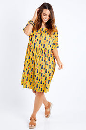 Model Laura wearing size 14 of the High Waist Relaxed Dress in colour Painting, from the front, showing the whole outfit