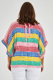 Model Monique wearing size 14 of the Tie Back Bell Sleeve Top in colour Hopscotch (Pink), from the back
