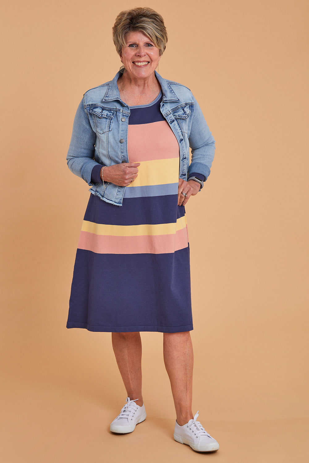 Model Lorraine wearing size S of the Knit Stripe Dress in colour Wintersky (Blue), from the front, showing the whole outfit
