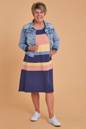 Model Lorraine wearing size S of the Knit Stripe Dress in colour Wintersky (Blue), from the front, showing the whole outfit
