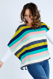 Model Madeline wearing size 10 of the Oversized Printed Tunic in colour Rainbow (Blue), from the front, cropped image
