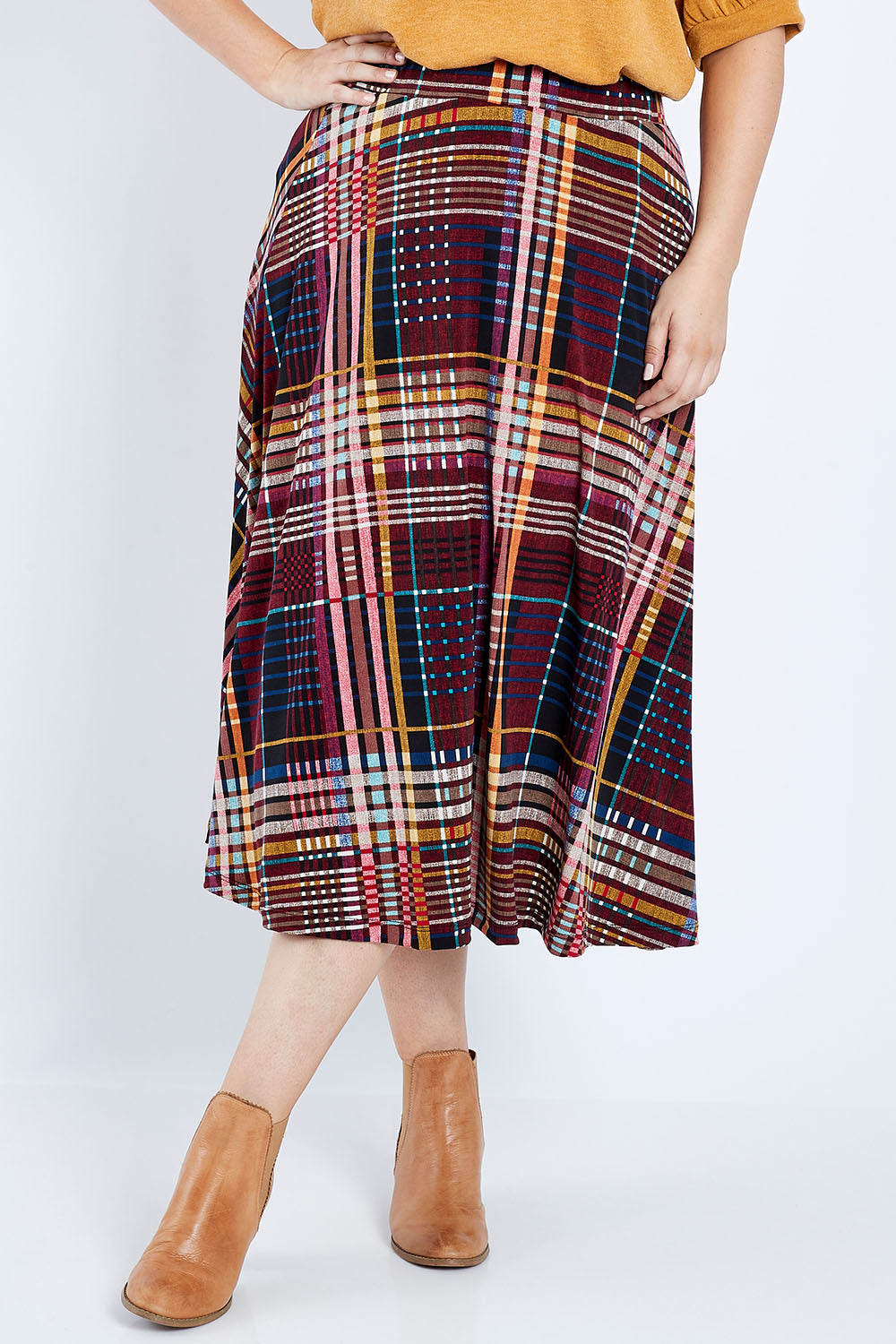 Model Jess wearing size 14 of the Calf Length Full Skirt in colour Checked (Black), from the front, cropped image