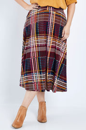 Model Jess wearing size 14 of the Calf Length Full Skirt in colour Checked (Black), from the front, cropped image