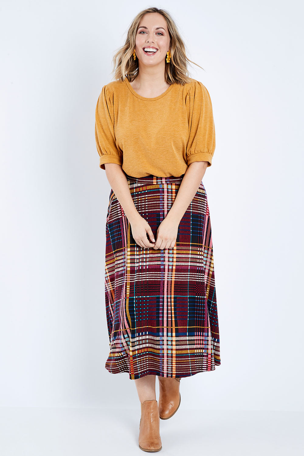 Model Jess wearing size 14 of the Calf Length Full Skirt in colour Checked (Black), from the front, showing the whole outfit