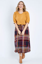 Model Jess wearing size 14 of the Calf Length Full Skirt in colour Checked (Black), from the front, showing the whole outfit