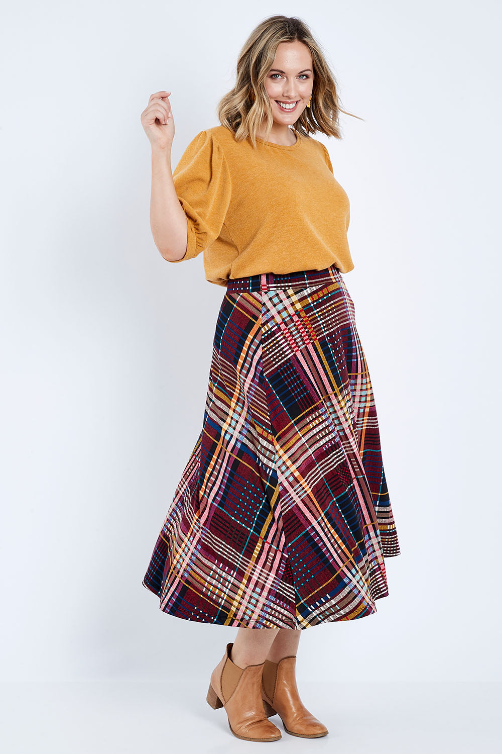 Model Jess wearing size 14 of the Calf Length Full Skirt in colour Checked (Black), from the front, showing the whole outfit