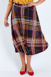 Model Sasha-Lee wearing size 16 of the Calf Length Full Skirt in colour Checked (Black), from the front, cropped image