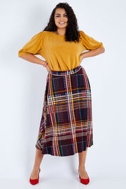 Model Sasha-Lee wearing size 16 of the Calf Length Full Skirt in colour Checked (Black), from the front, showing the whole outfit
