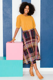 Model Schanez wearing size 10 of the Calf Length Full Skirt in colour Checked (Black), from the front, showing the whole outfit