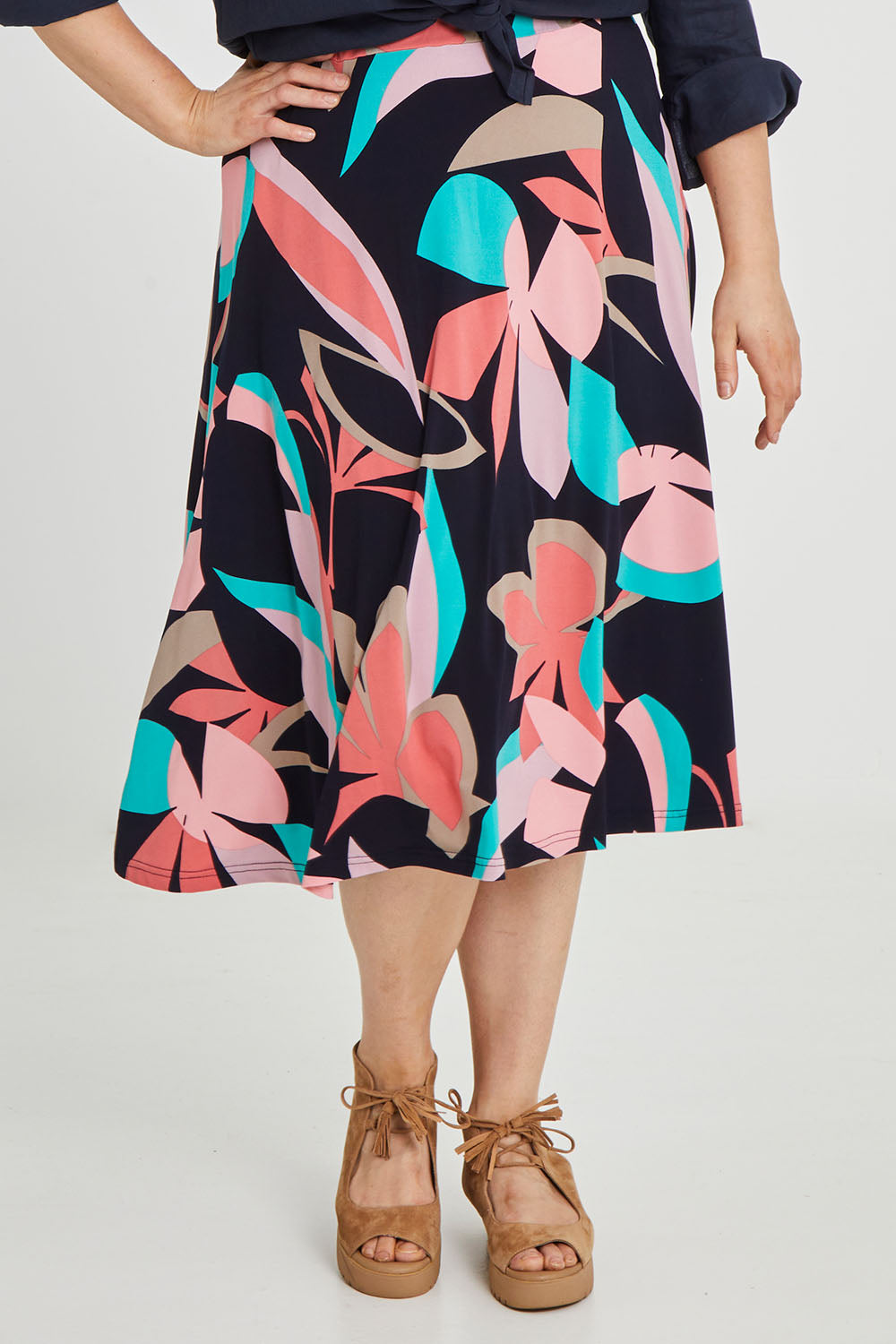 Model Keeara wearing size 16 of the Printed Calf Length Full Skirt in colour Pastels (Blue), from the front, cropped image
