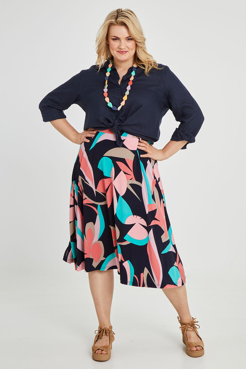 Model Keeara wearing size 16 of the Printed Calf Length Full Skirt in colour Pastels (Blue), from the front, showing the whole outfit