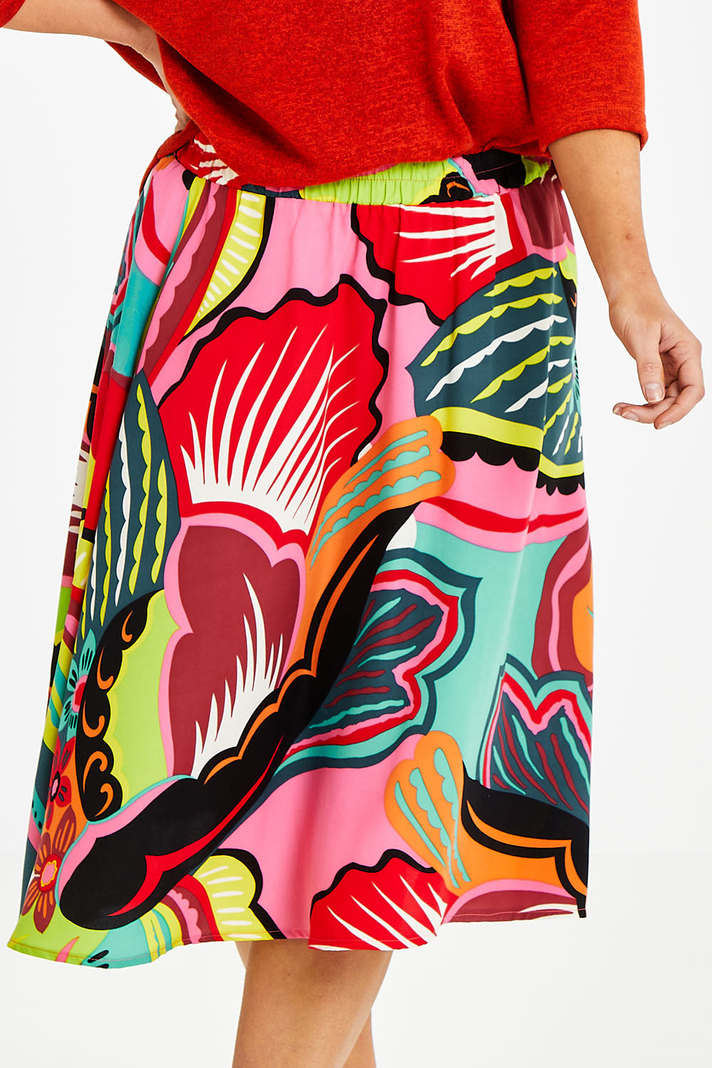 Model Laura wearing size 14 of the Printed Knee Length Skirt in colour Bloom (Pink), from the front, cropped image