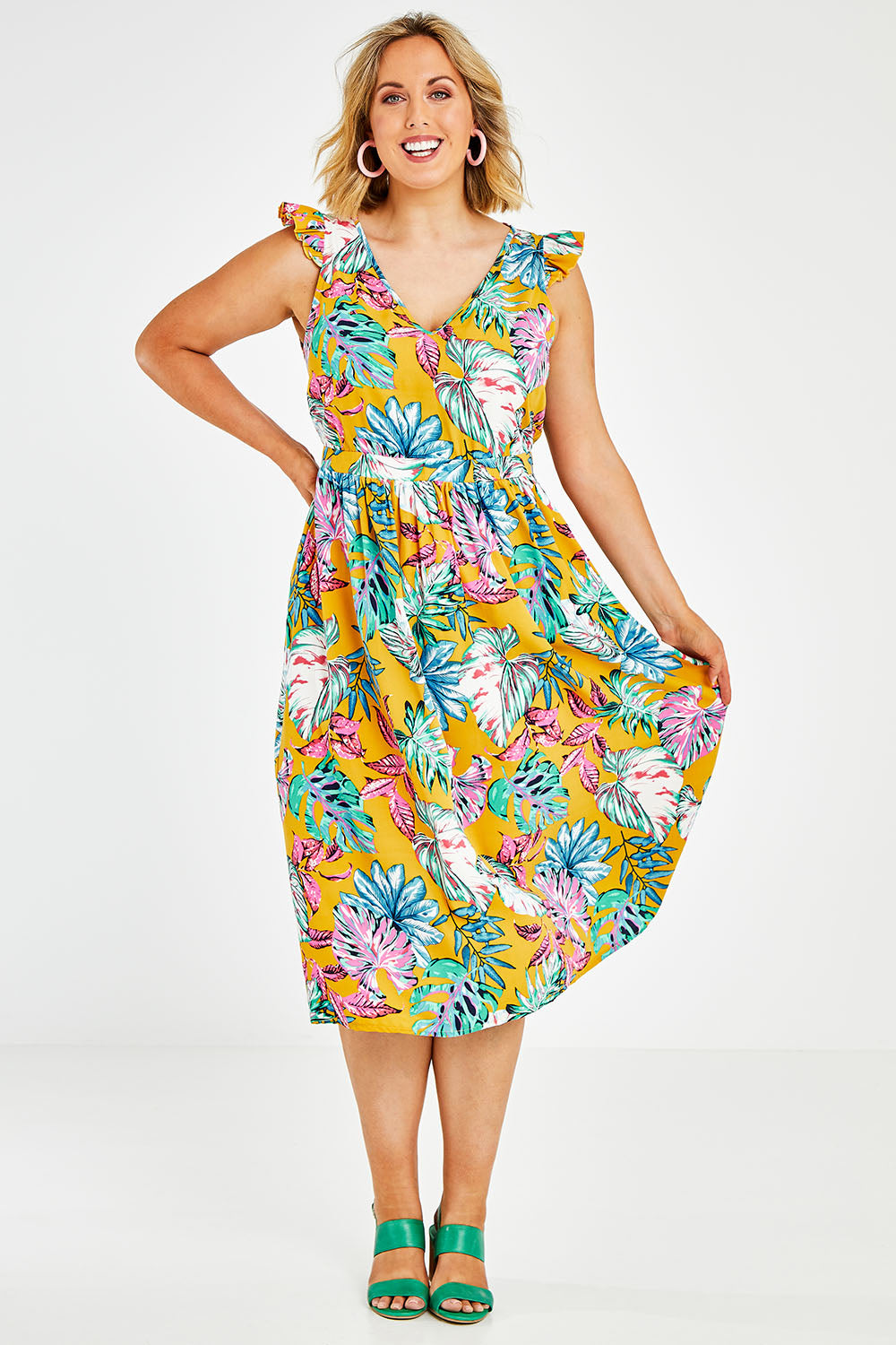 Model Jess wearing size 14 of the V Neck Gathered Sleeve Dress in colour Garden, from the front, showing the whole outfit