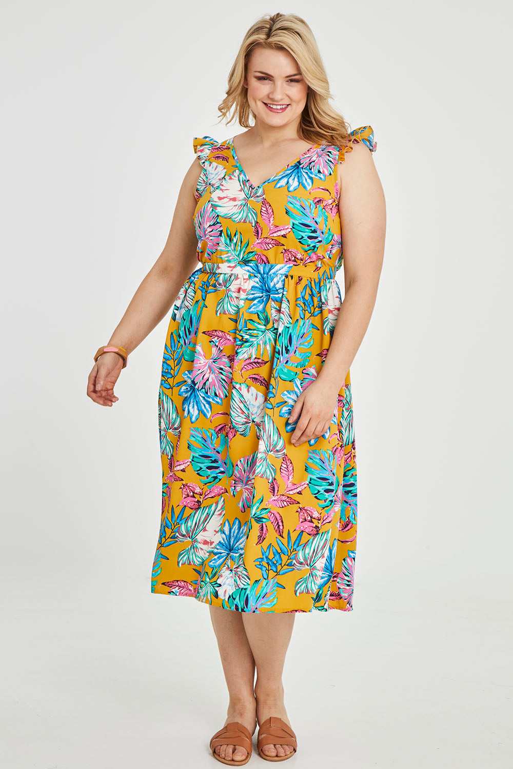 Model Keeara wearing size 16 of the V Neck Gathered Sleeve Dress in colour Garden, from the front, showing the whole outfit
