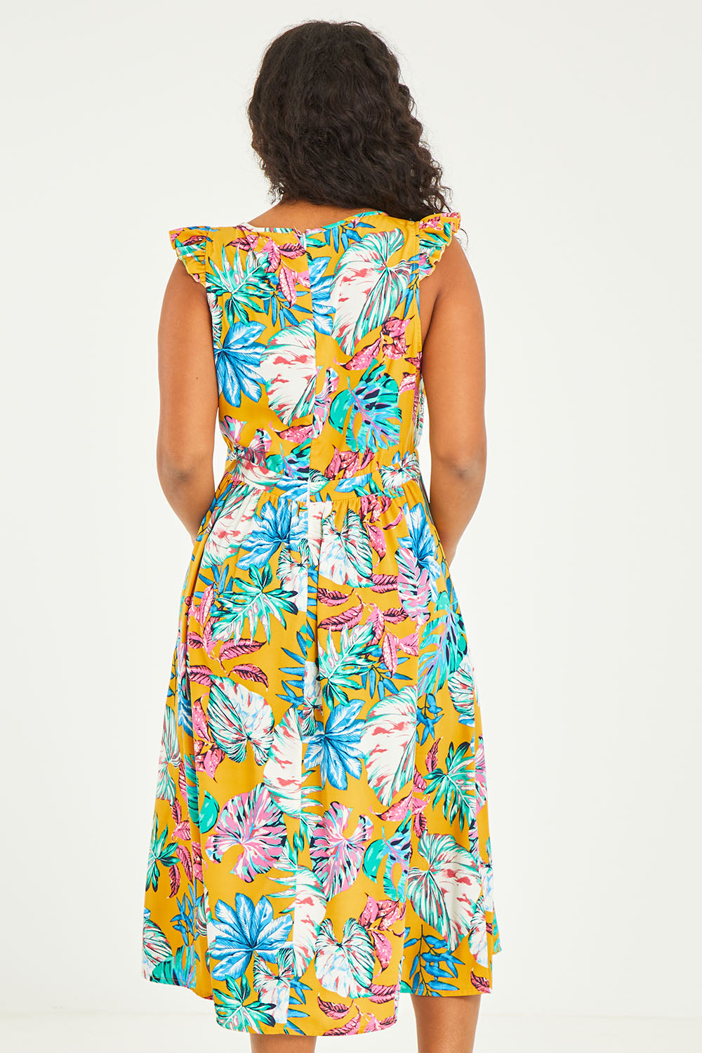 Model Noli wearing size 14 of the V Neck Gathered Sleeve Dress in colour Garden, from the back