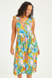 Model Noli wearing size 14 of the V Neck Gathered Sleeve Dress in colour Garden, from the front, cropped image