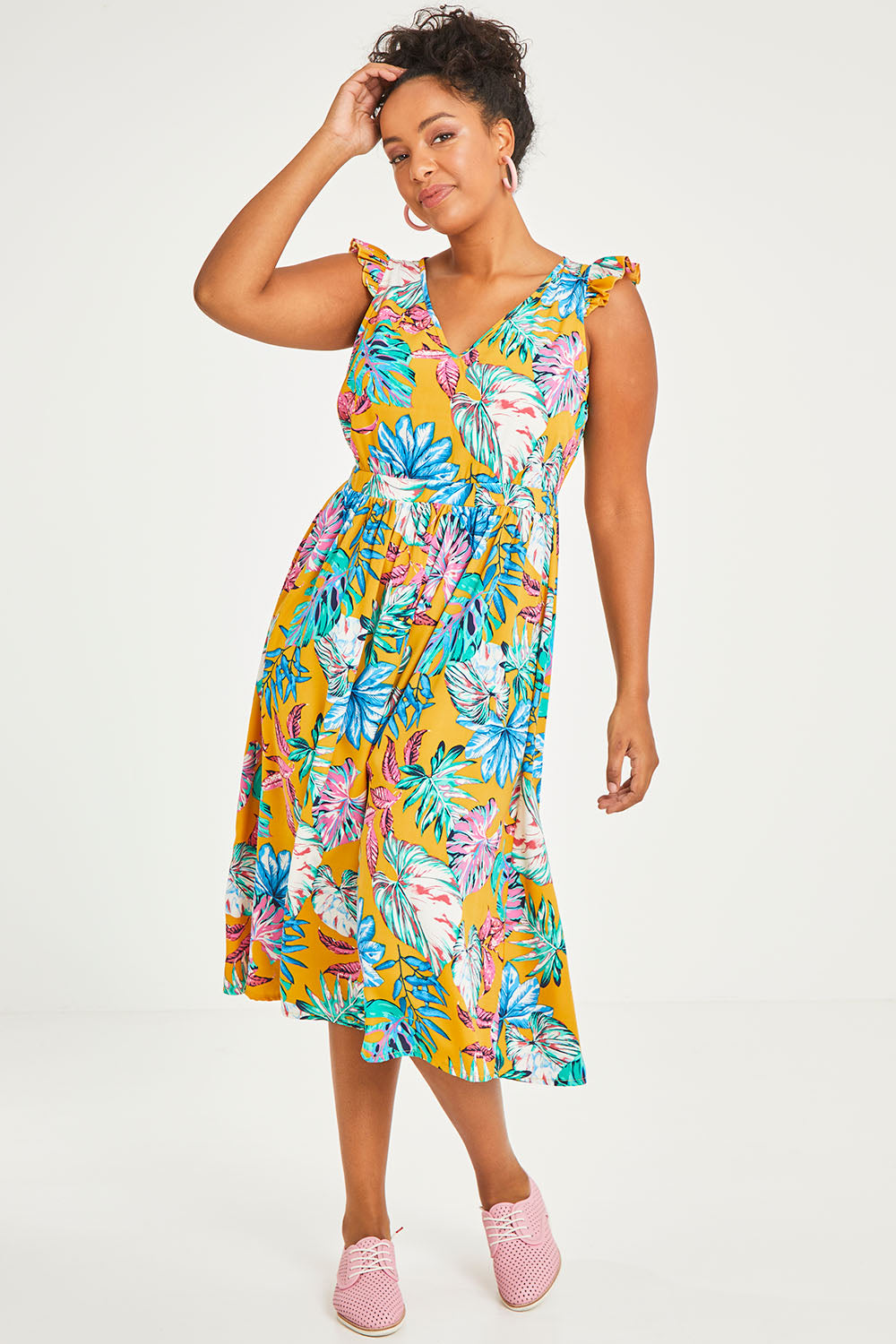 Model Noli wearing size 14 of the V Neck Gathered Sleeve Dress in colour Garden, from the front, showing the whole outfit