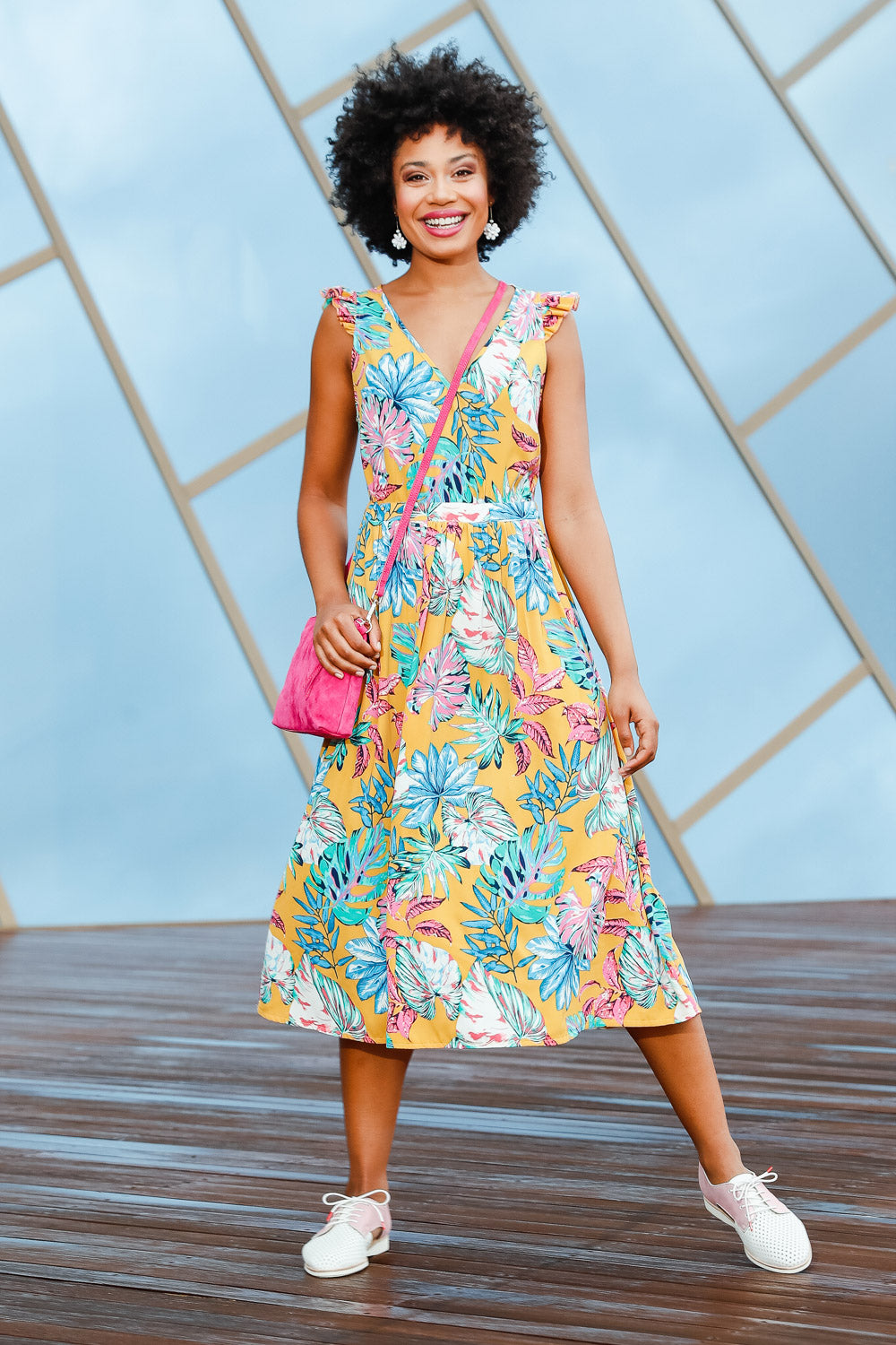 Model Olivia wearing size 10 of the V Neck Gathered Sleeve Dress in colour Garden, from the front, showing the whole outfit