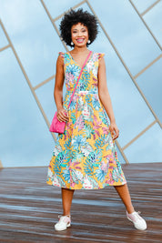 Model Olivia wearing size 10 of the V Neck Gathered Sleeve Dress in colour Garden, from the front, showing the whole outfit