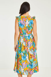 Model Stacey wearing size 10 of the V Neck Gathered Sleeve Dress in colour Garden, from the back