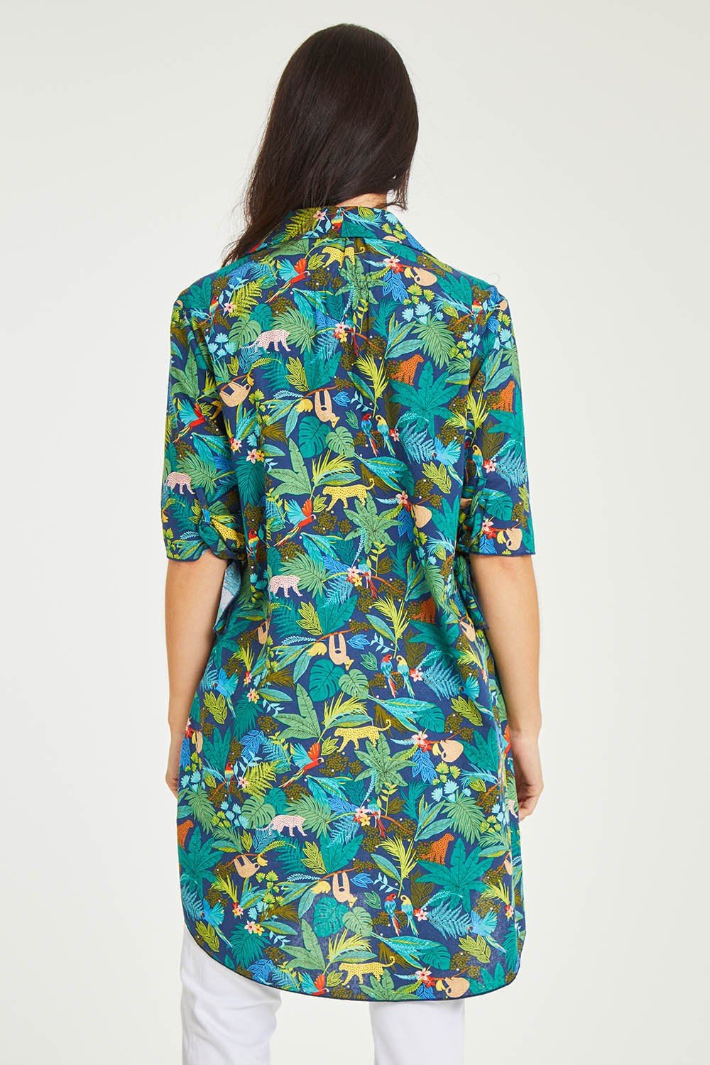Model Stacey wearing size 10 of the Printed Tunic in colour Jungle (Blue), from the back