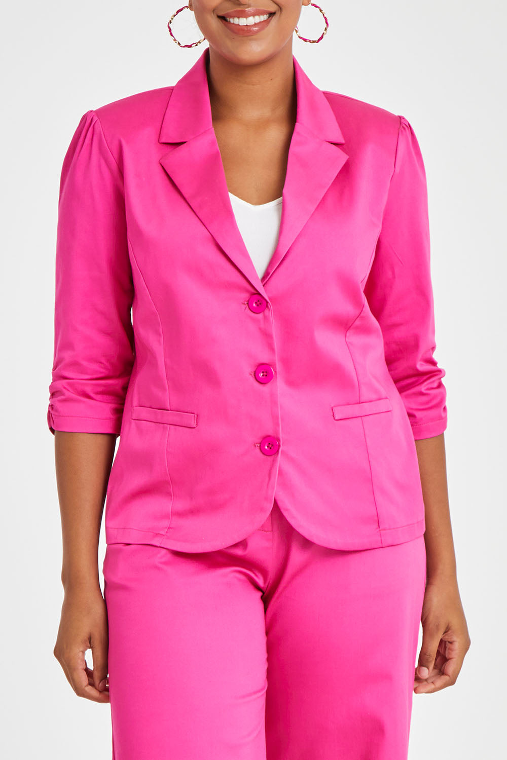 Model Noli wearing size 14 of the Buttoned Blazer in colour Hotpink (Pink), from the front, cropped image