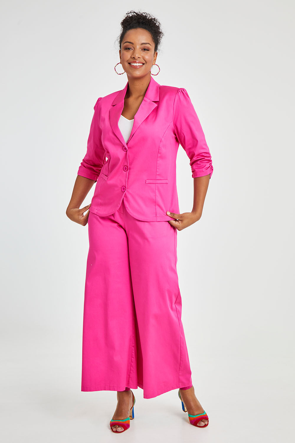Model Noli wearing size 14 of the Buttoned Blazer in colour Hotpink (Pink), from the front, showing the whole outfit
