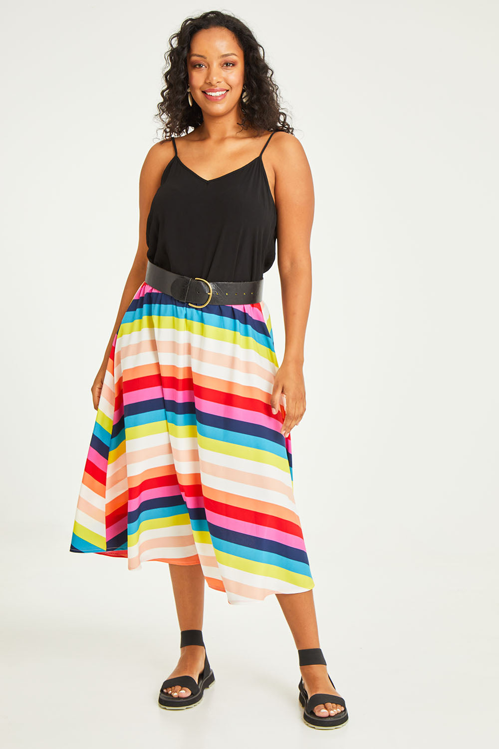 Model Noli wearing size 14 of the Gathered Waist Calf Length Skirt in colour Potofgold (White), from the front, showing the whole outfit