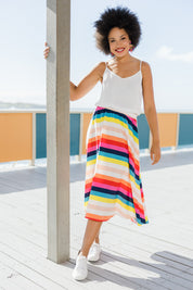 Model Olivia wearing size 10 of the Gathered Waist Calf Length Skirt in colour Potofgold (White), from the front, showing the whole outfit