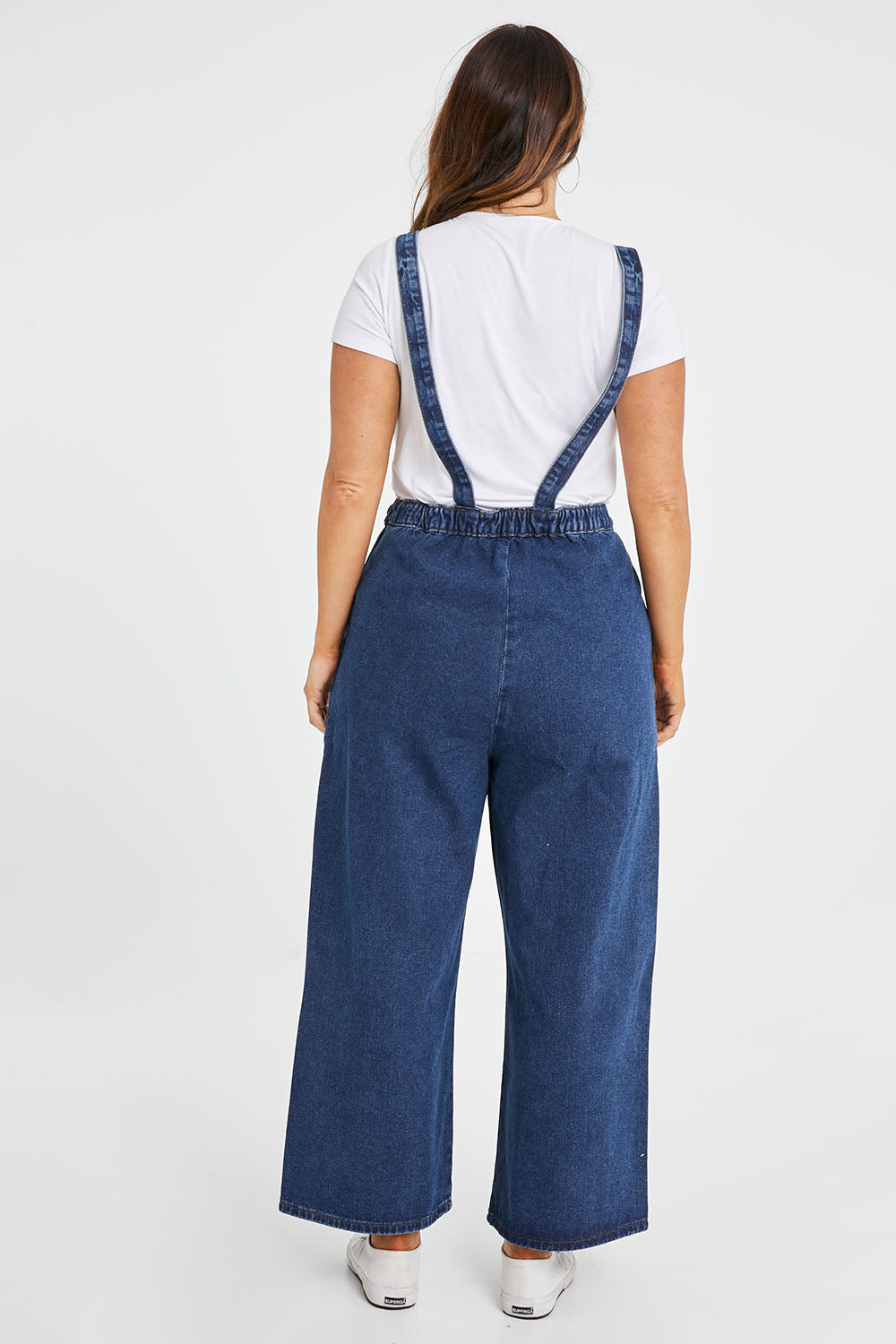 Model Laura wearing size 14 of the Star Overalls in colour Star (Blue), from the back