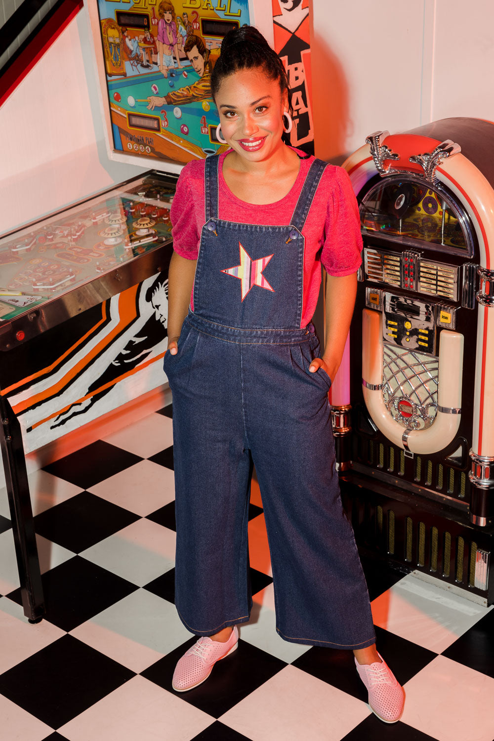 Model Olivia wearing size 10 of the Star Overalls in colour Star (Blue), from the front, showing the whole outfit