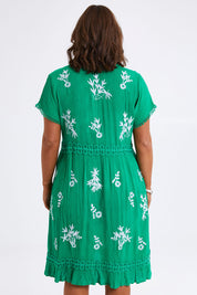 Model Monique wearing size 14 of the Embroidered Lace Detail Dress in colour Greenwhite (Green), from the back
