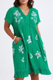 Model Monique wearing size 14 of the Embroidered Lace Detail Dress in colour Greenwhite (Green), from the front, cropped image