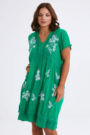 Model Monique wearing size 14 of the Embroidered Lace Detail Dress in colour Greenwhite (Green), from the front, cropped image