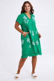Model Monique wearing size 14 of the Embroidered Lace Detail Dress in colour Greenwhite (Green), from the front, showing the whole outfit