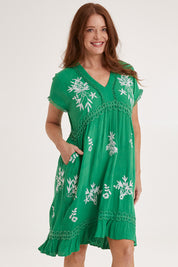 Model Sally wearing size 10 of the Embroidered Lace Detail Dress in colour Greenwhite (Green), from the front, cropped image
