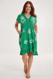 Model Sally wearing size 10 of the Embroidered Lace Detail Dress in colour Greenwhite (Green), from the front, showing the whole outfit