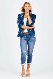 Model Emma wearing size 10 of the Printed Blazer in colour Blossom (Blue), from the front, showing the whole outfit
