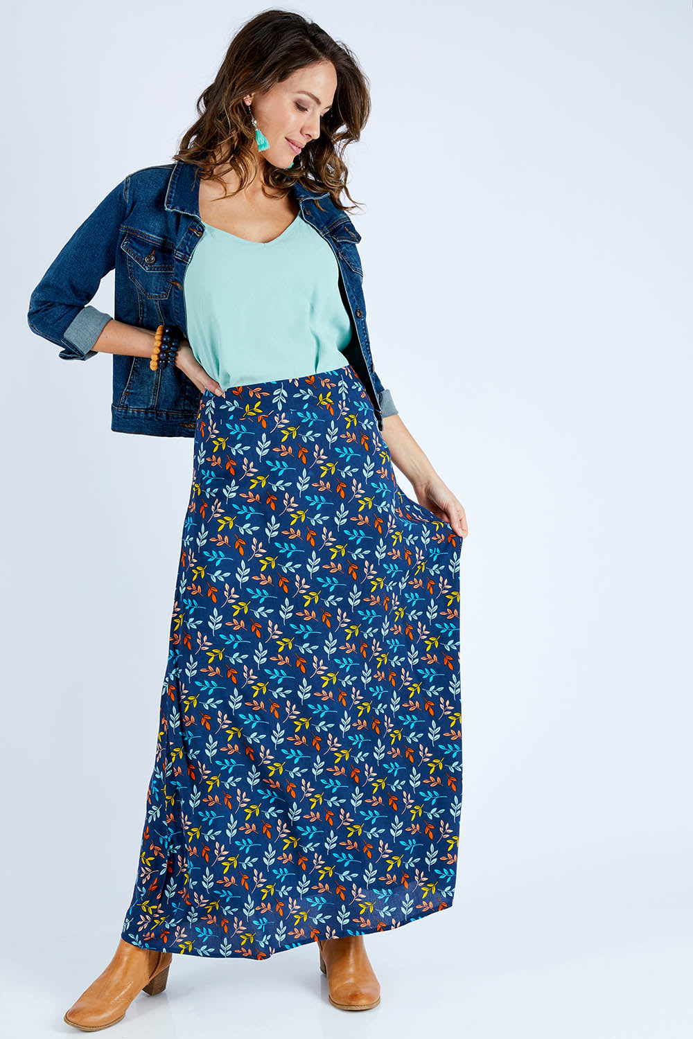 Model Madeline wearing size 10 of the Printed Maxi Skirt in colour Autumn (Blue), from the front, showing the whole outfit
