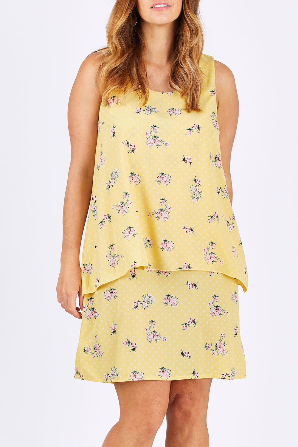 Model Laura wearing size 12 of the Tier Dress in colour Lemons, from the front, cropped image