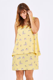 Model Laura wearing size 12 of the Tier Dress in colour Lemons, from the front, cropped image