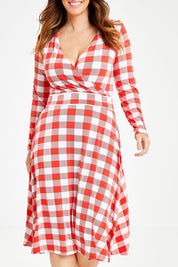 Model Laura wearing size 14 of the Printed Faux Wrap Dress in colour Redcheck (Red), from the front, cropped image