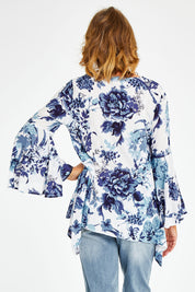 Model Naomi wearing size S of the Cuba Top in colour Blueprint (Blue), from the back