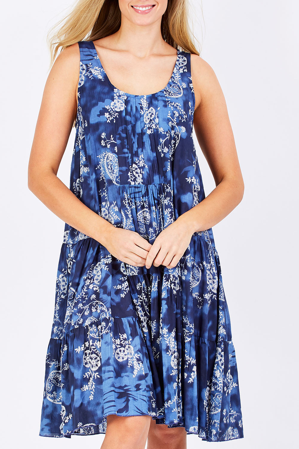 Model Maddy wearing size S of the Mirimar Dress in colour Lantana (Blue), from the front, cropped image