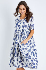 Model Elhana wearing the Aruba Dress in colour Pomelo (Blue), from the front, cropped image