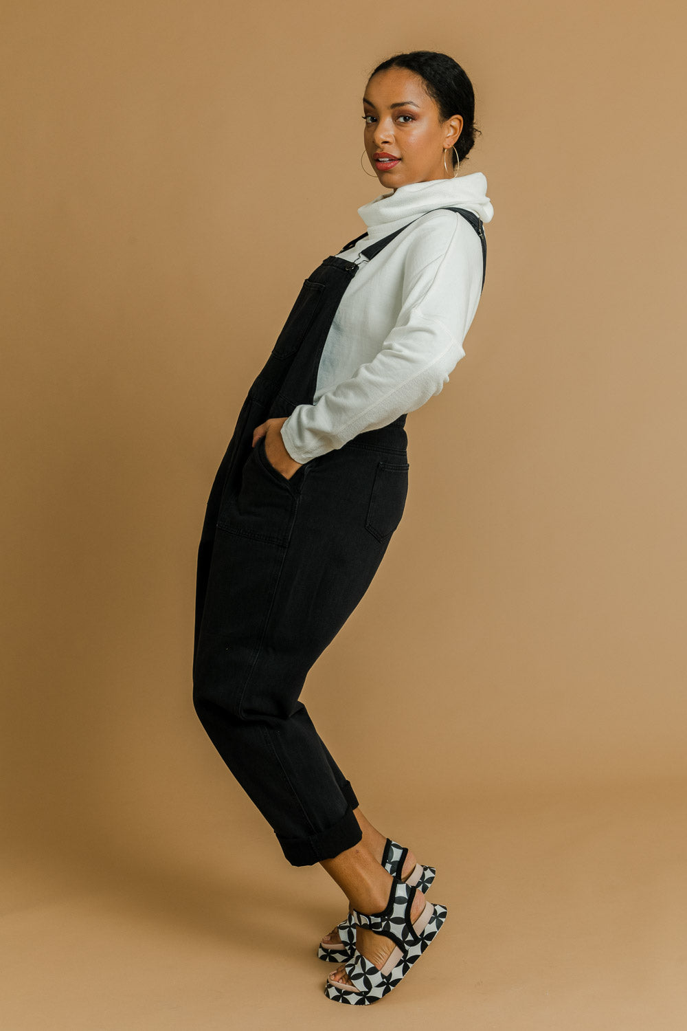 Model Noli wearing size 14 of the Matilda Overalls in colour Blackwash (Black), from the front, showing the whole outfit