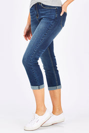 Model Madeline wearing size 10 of the Chloe High Rise Rolled Crop in colour DarkWash (Blue), from the front, cropped image