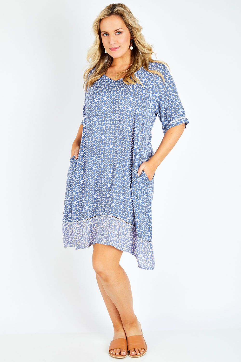 Model Jess wearing size 14 of the Safina Dress in colour Bluedenim (Blue), from the front, showing the whole outfit