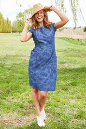 Model Katie wearing size 10 of the Victoria Dress in colour LinearFlor (Blue), from the front, showing the whole outfit
